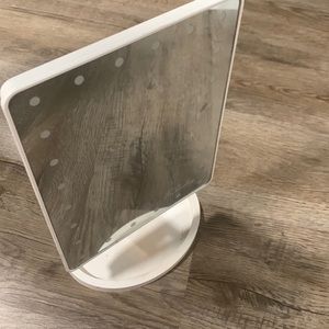 White mirror with lights